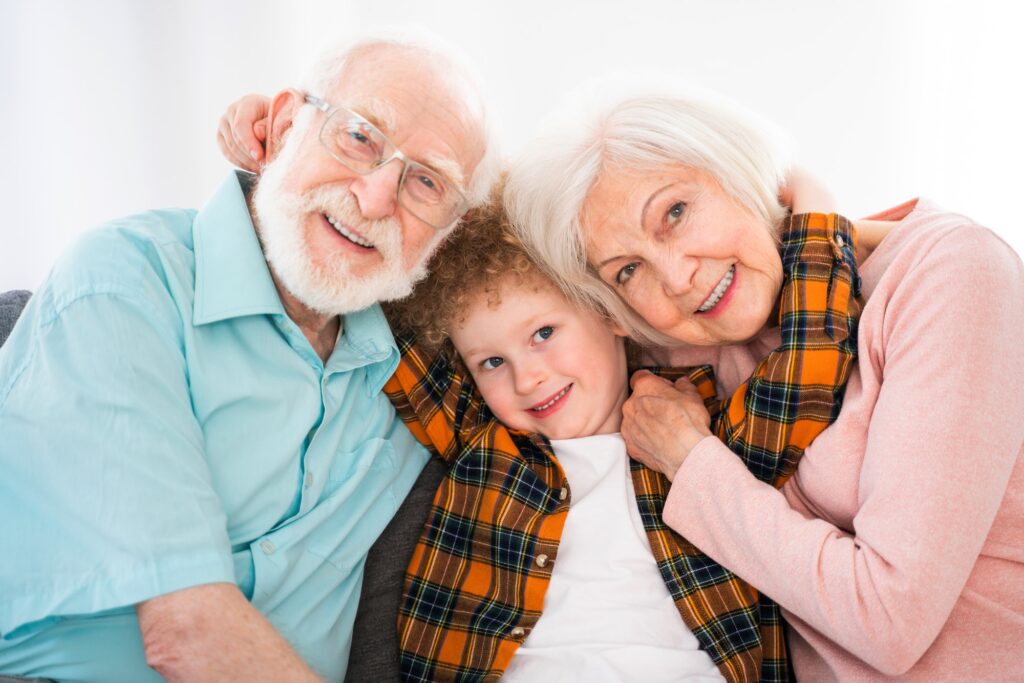 Grandparents and grandson playing at home